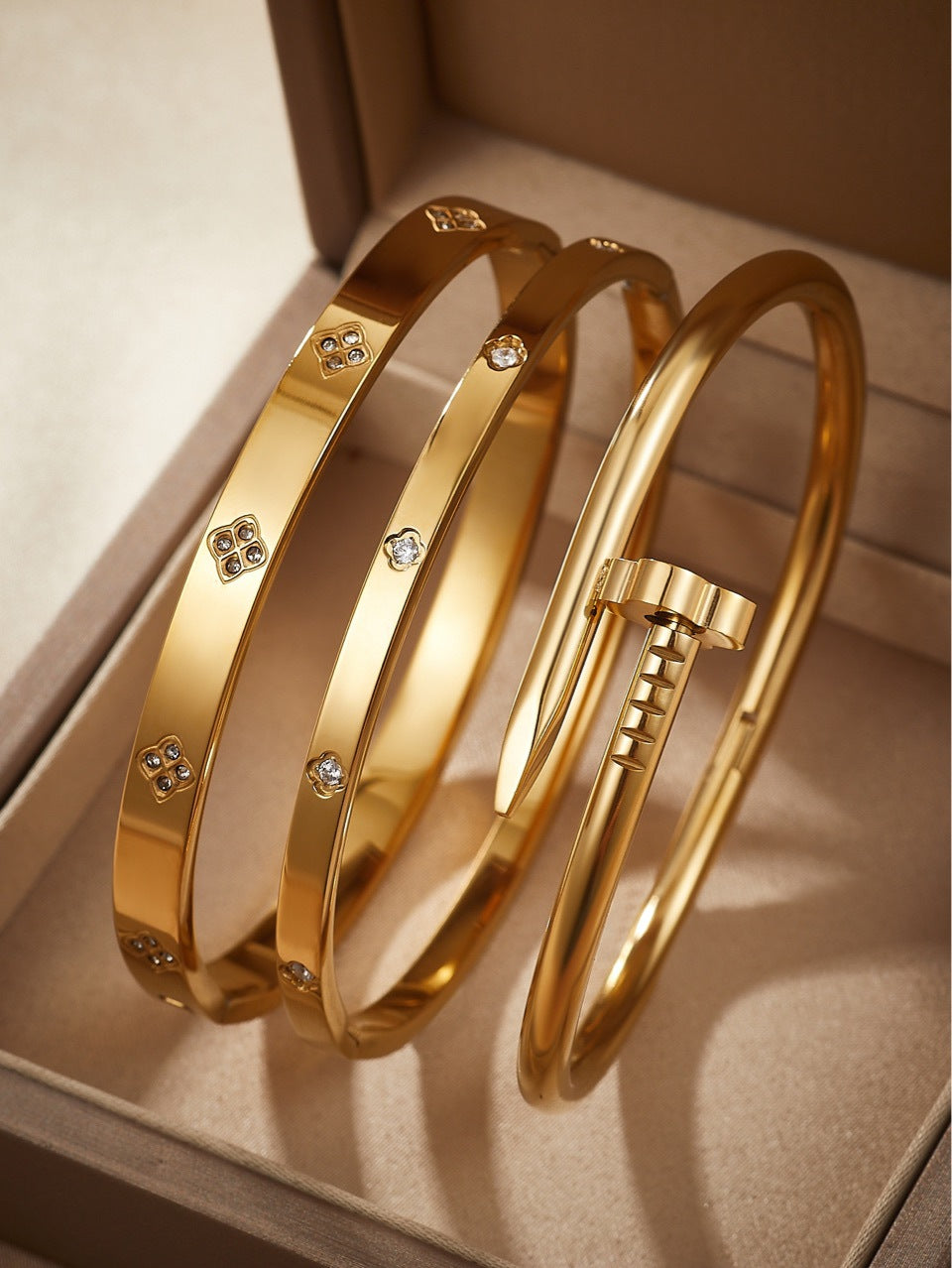 gold bangle set, stainless steel bracelet, minimalist jewelry, nail bangle, geometric design, stacking bangles, luxury gold tone, crystal accent, modern bracelet, daily wear jewelry, statement bracelet, waterproof jewelry, timeless gold SL-083