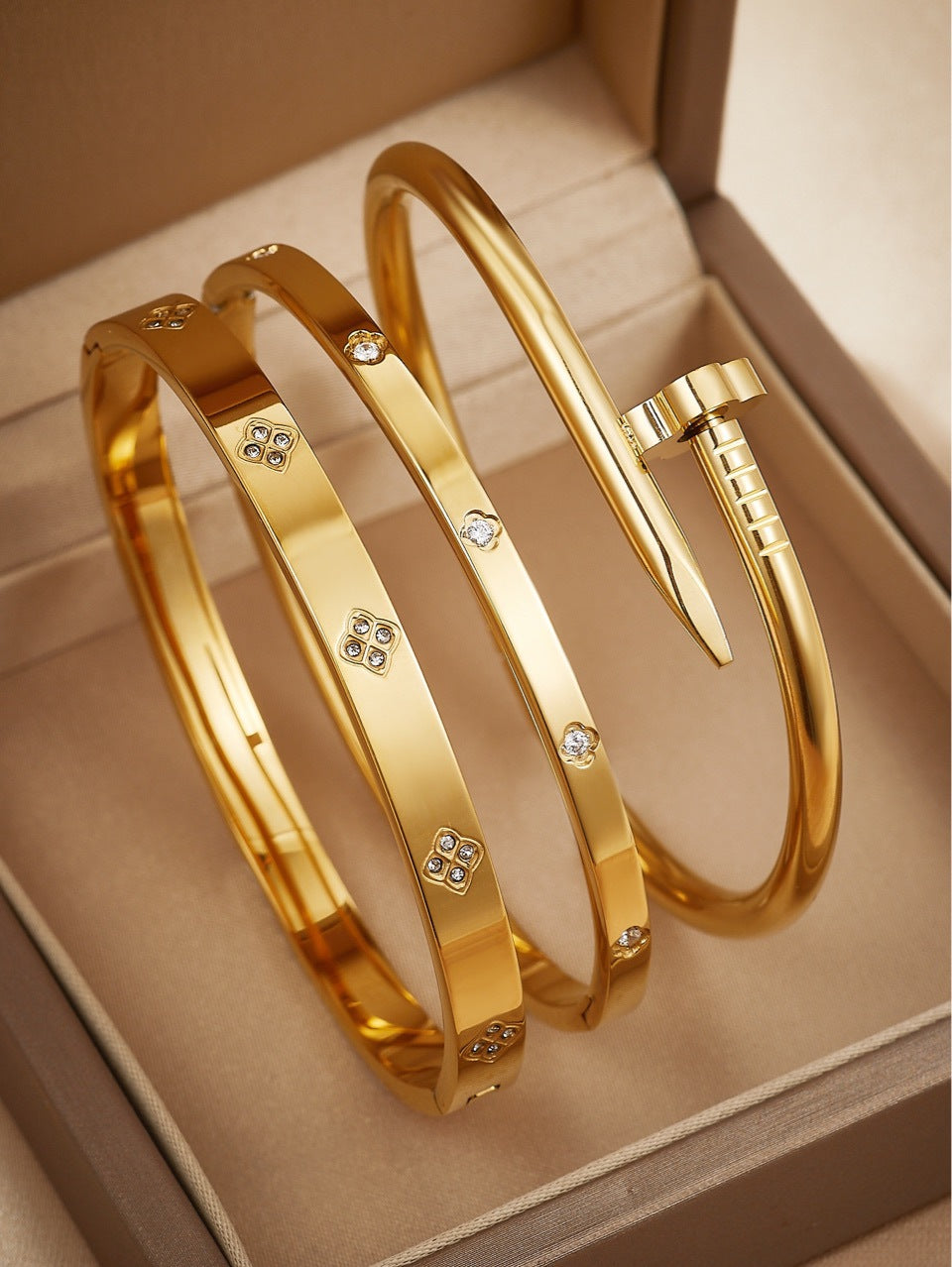 gold bangle set, stainless steel bracelet, minimalist jewelry, nail bangle, geometric design, stacking bangles, luxury gold tone, crystal accent, modern bracelet, daily wear jewelry, statement bracelet, waterproof jewelry, timeless gold SL-083