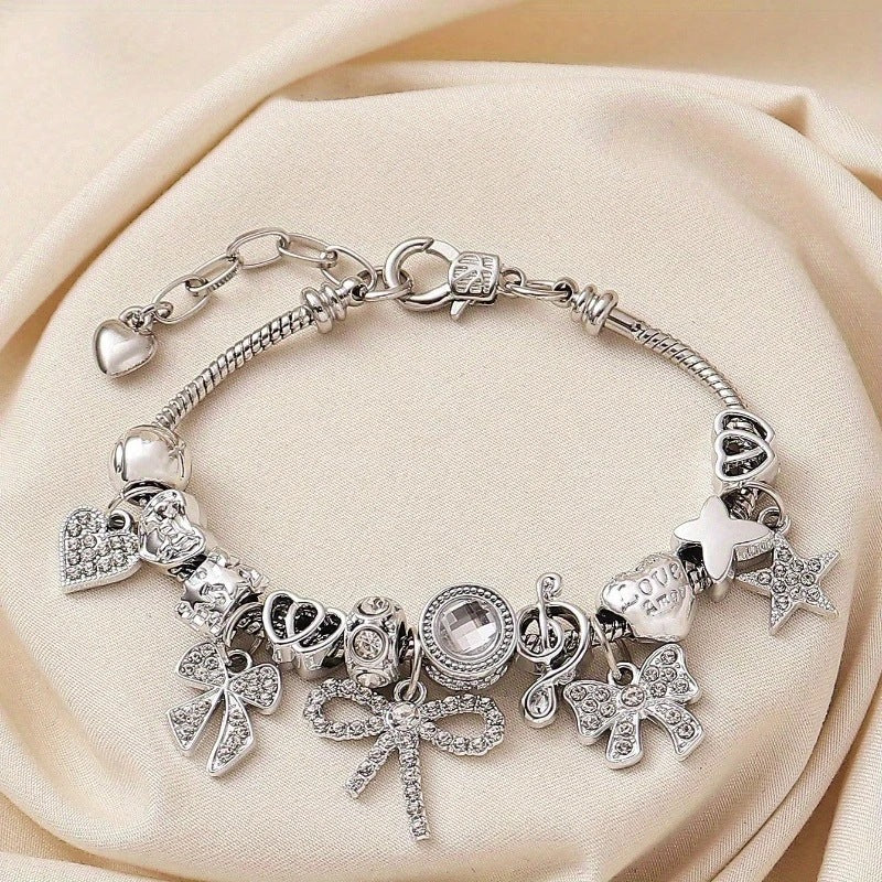 charm bracelet, bow charm bracelet, heart charm bracelet, crystal bracelet, silver snake chain bracelet, statement jewelry, adjustable bracelet, feminine jewelry, gift for her, elegant daily accessory SL-095