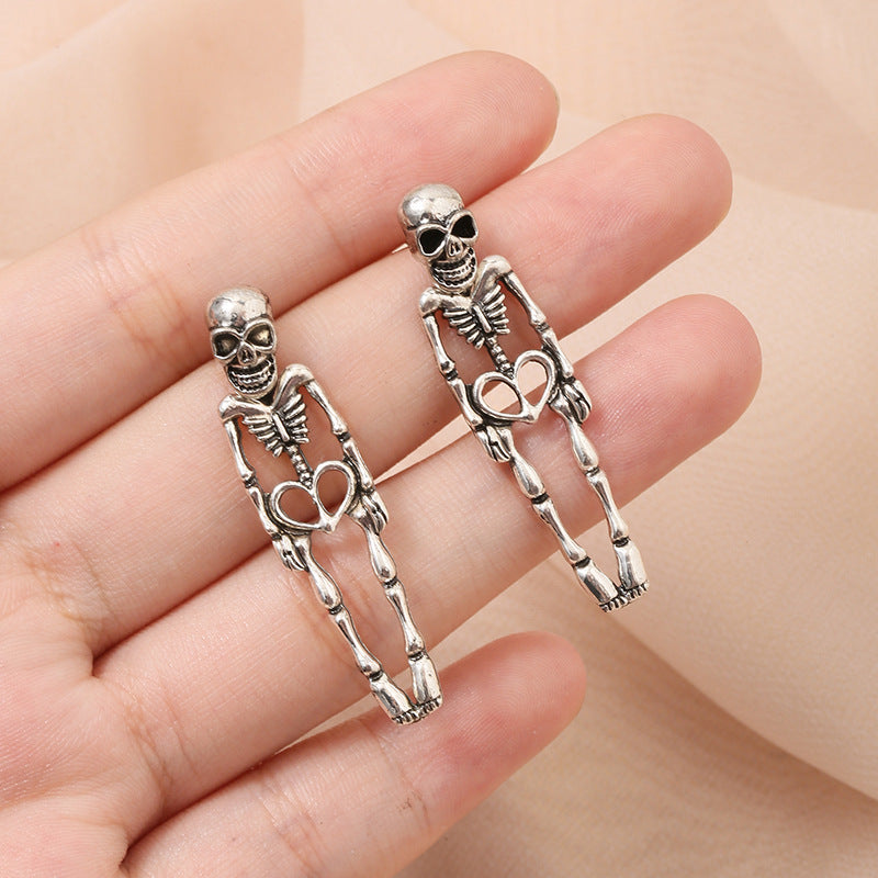skeleton earrings, gothic jewelry, punk earrings, halloween style, silver statement earrings, edgy design, vintage skeleton studs, bold fashion, daily casual gothic, cool accessories EH-069