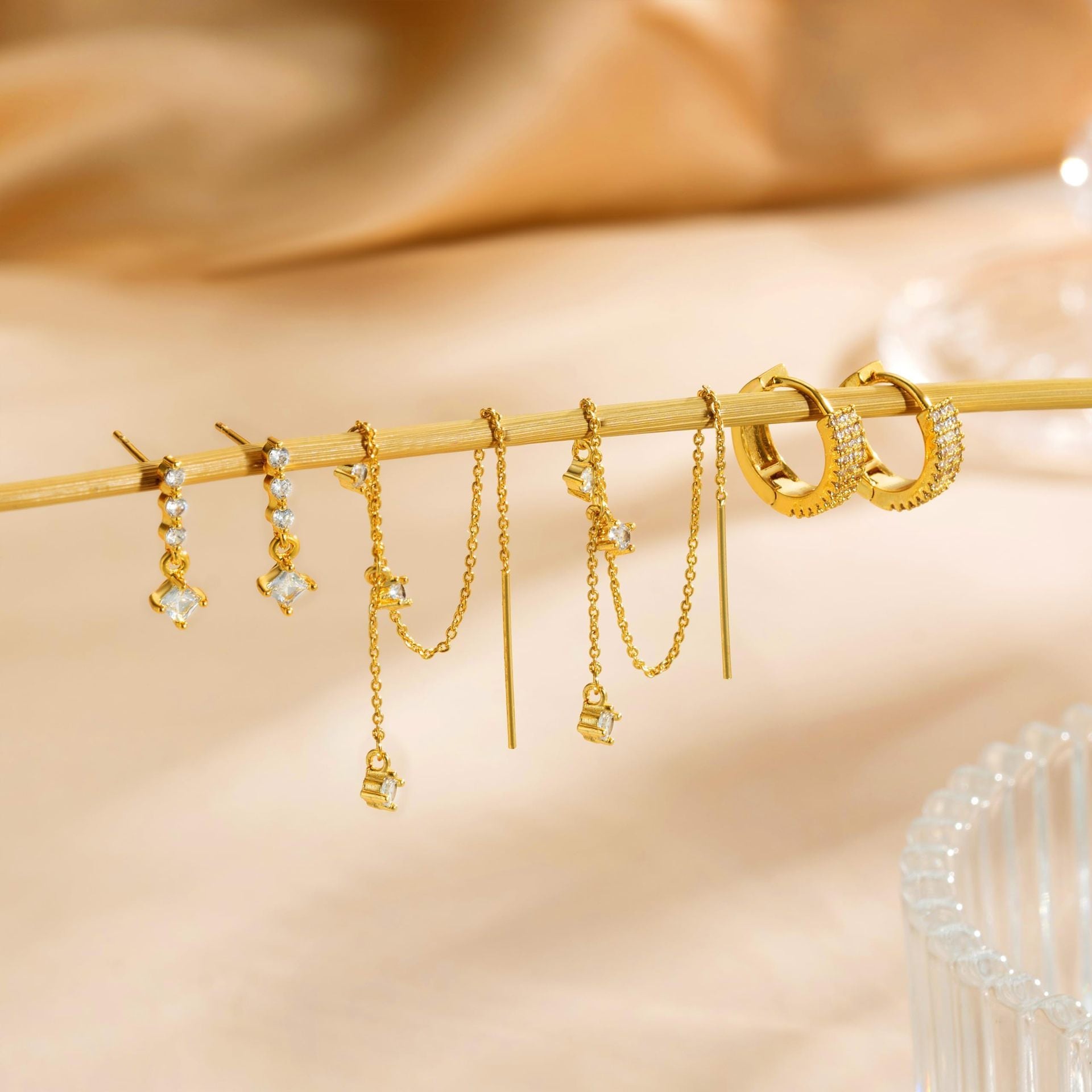 gold earring set, layered earrings, dainty chains, cubic zirconia jewelry, minimalist glam, pearl detail, asymmetric earrings, elegant statement, night out jewelry, mix and match EH-075