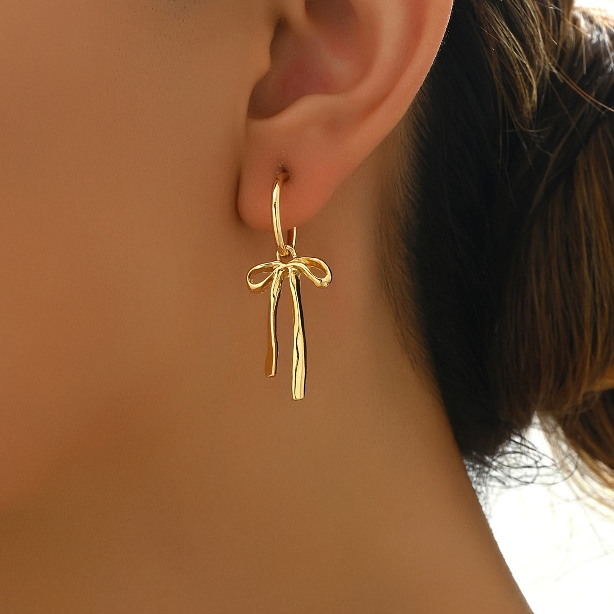bow earrings, gold earrings, minimalist earrings, dainty jewelry, ribbon earrings, statement earrings, daily wear earrings, artistic jewelry, modern design earrings, lightweight earrings EH-096