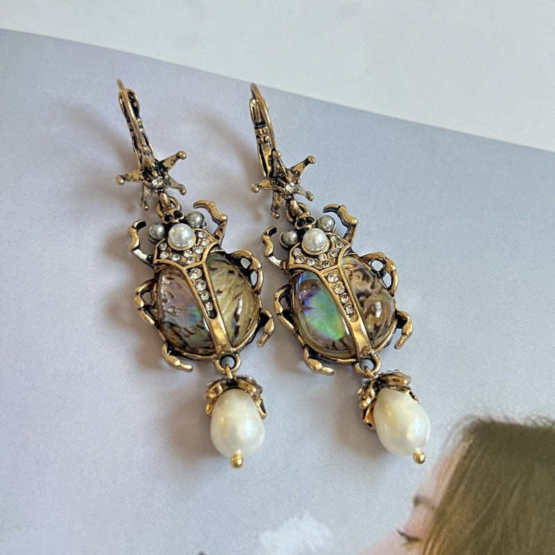 vintage beetle earrings, pearl drop earrings, statement jewelry, baroque style, abalone shell earrings, artistic earrings, bohemian luxury, retro glamour, unique insect earrings, opulent design EH-113