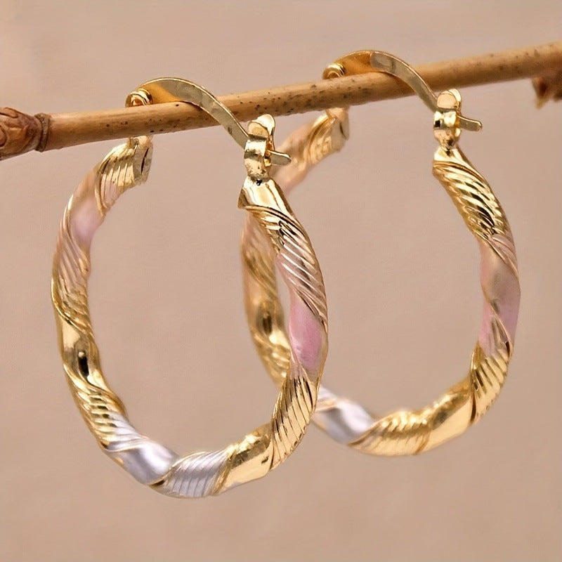 twisted hoop earrings, gold hoops, pink enamel detail, vintage style earrings, minimalist jewelry, statement hoops, everyday wear, lightweight earrings, 14K gold plated, elegant accessories EH-114